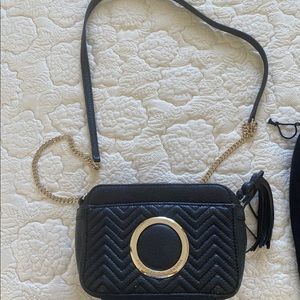 Purificacion Garcia black leather bag.